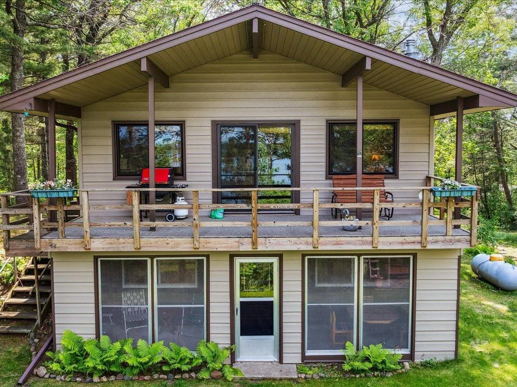 Upper wraparound deck and lower level screened in porch over look big water views