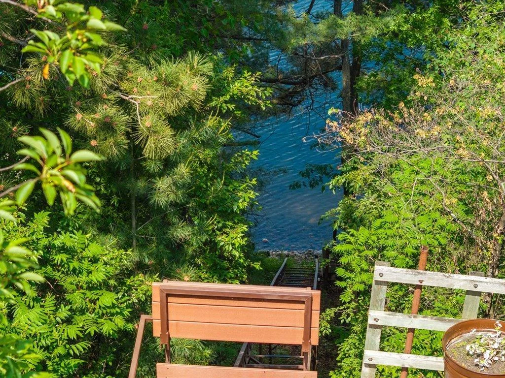 Just steps from the home, the lift makes every trip to the lake shore easy and picturesque