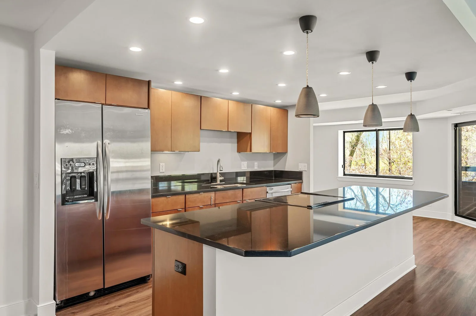 Center Island Kitchen with stone counter tops.