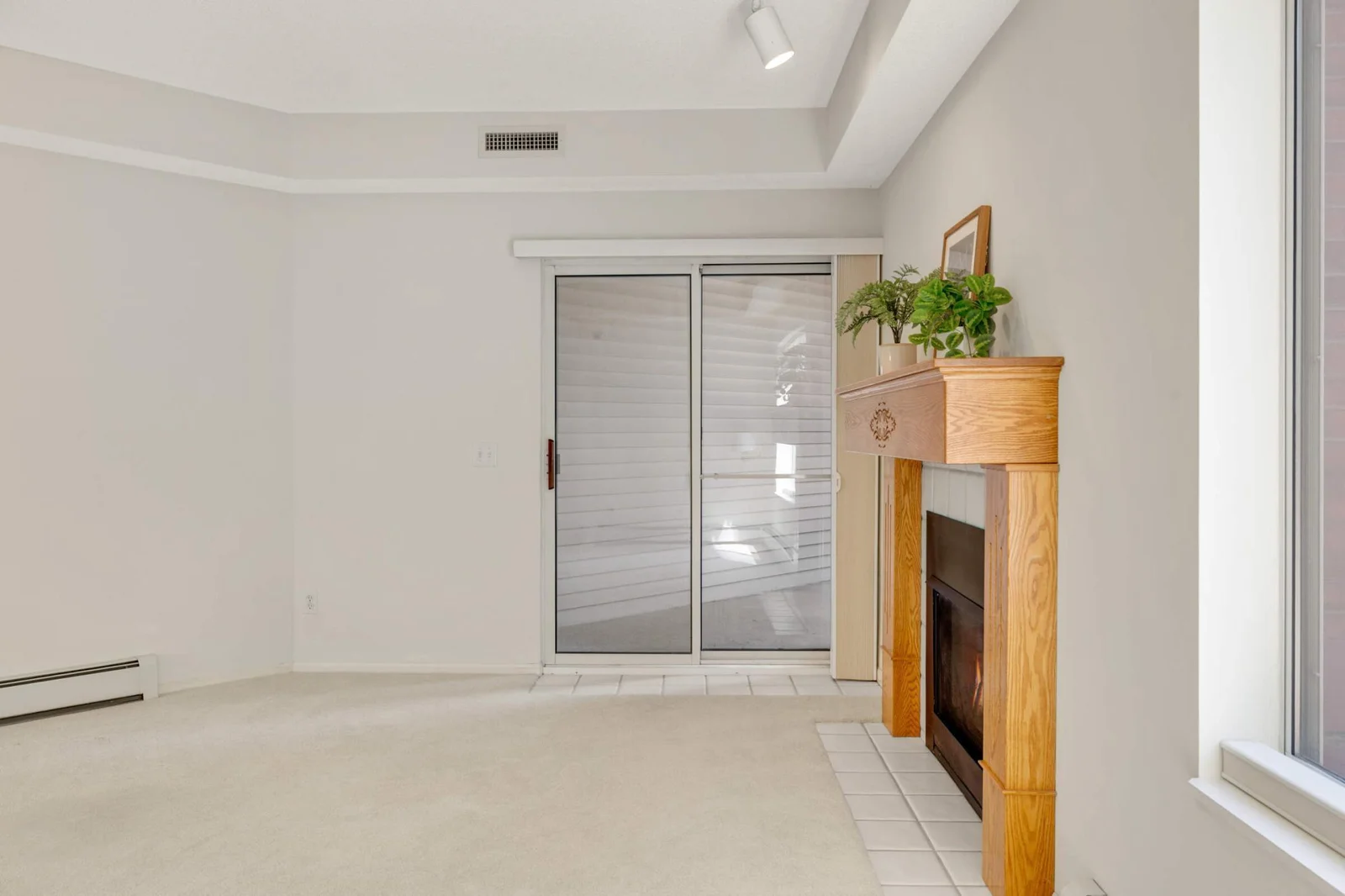 Step out to the covered patio overlooking green space
