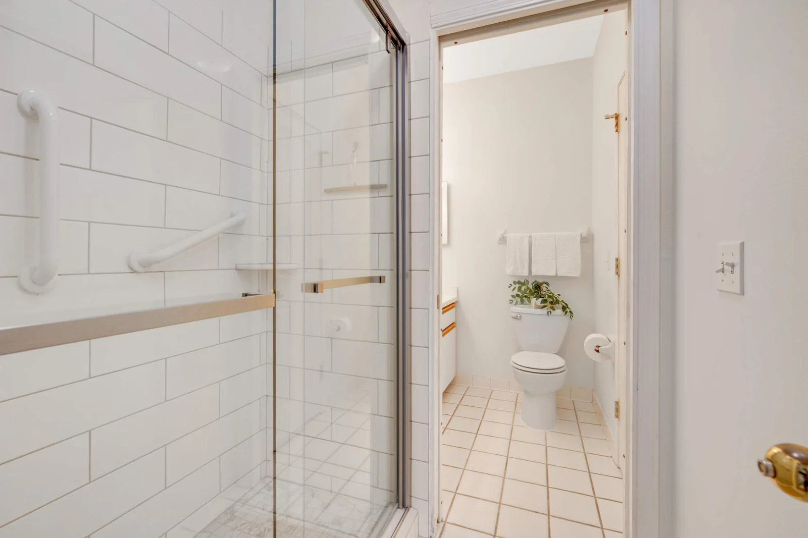 There is a pocket door in between the shower and vanity area for 2 people to get ready at the same time