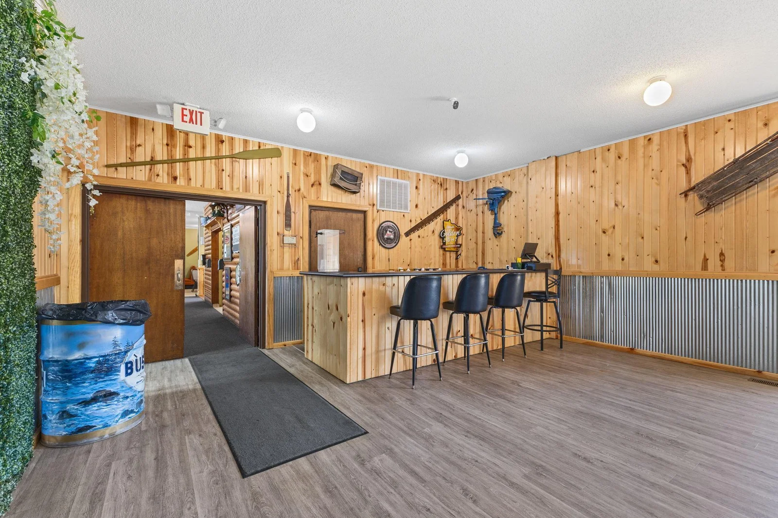 Entrance to the additional dining or event space.  Knotty pine decor makes this room very inviting