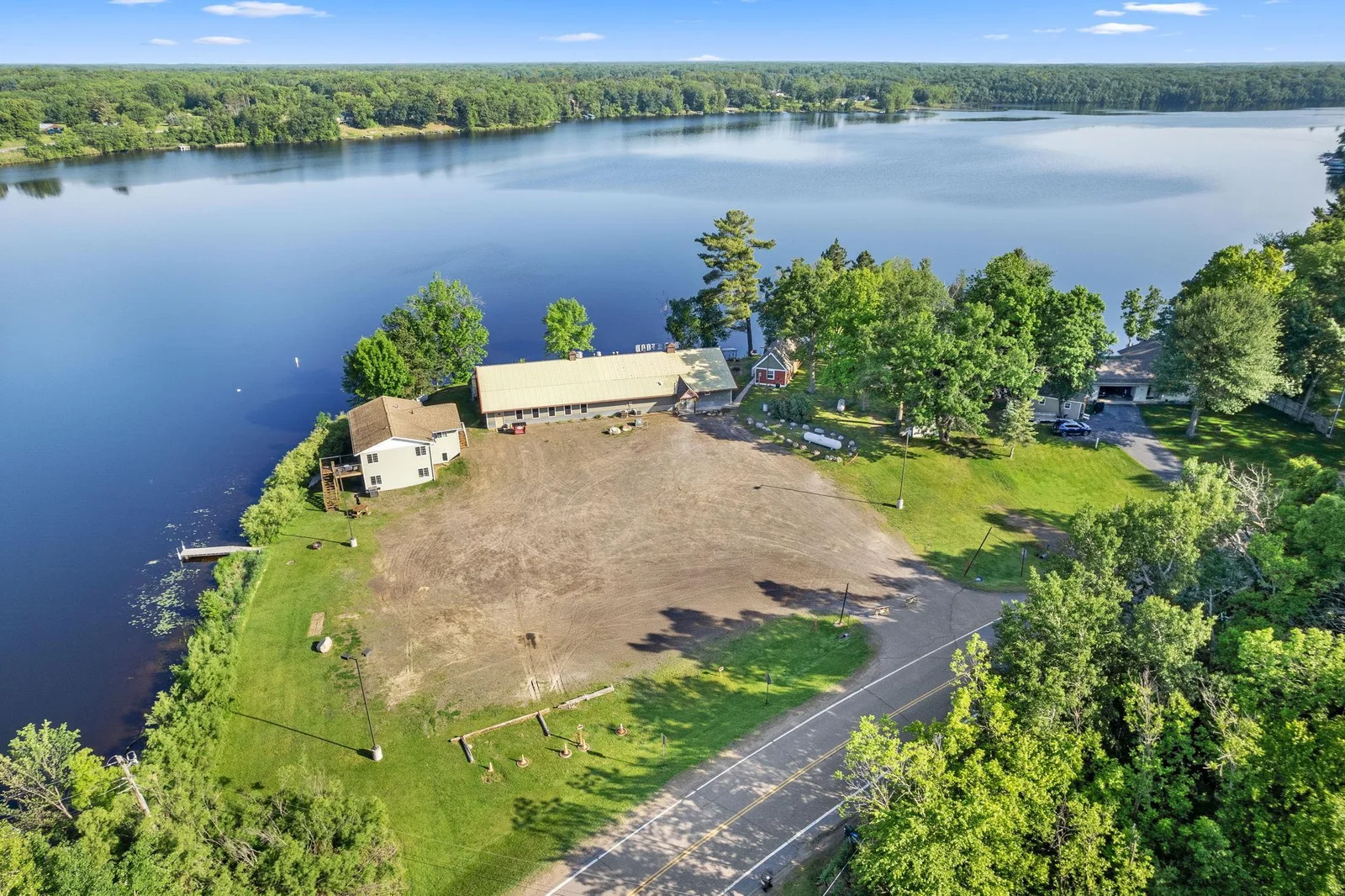 Aerial view of the three buildings and large parking lot.  There are 2 separate septic systems.