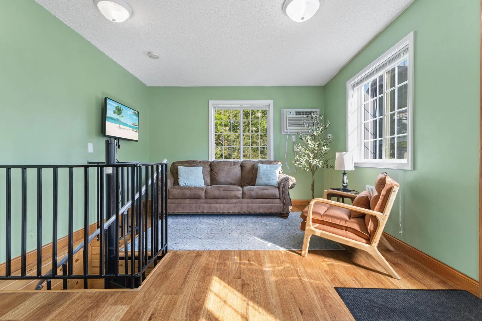 Livingroom and a spiral staircase.   There is another staircase to use as well.