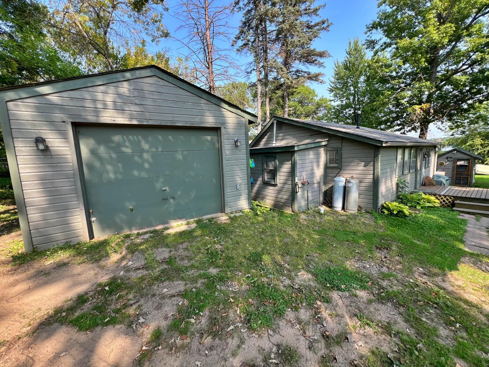 Garage with bunk house and cabin road side.jpg