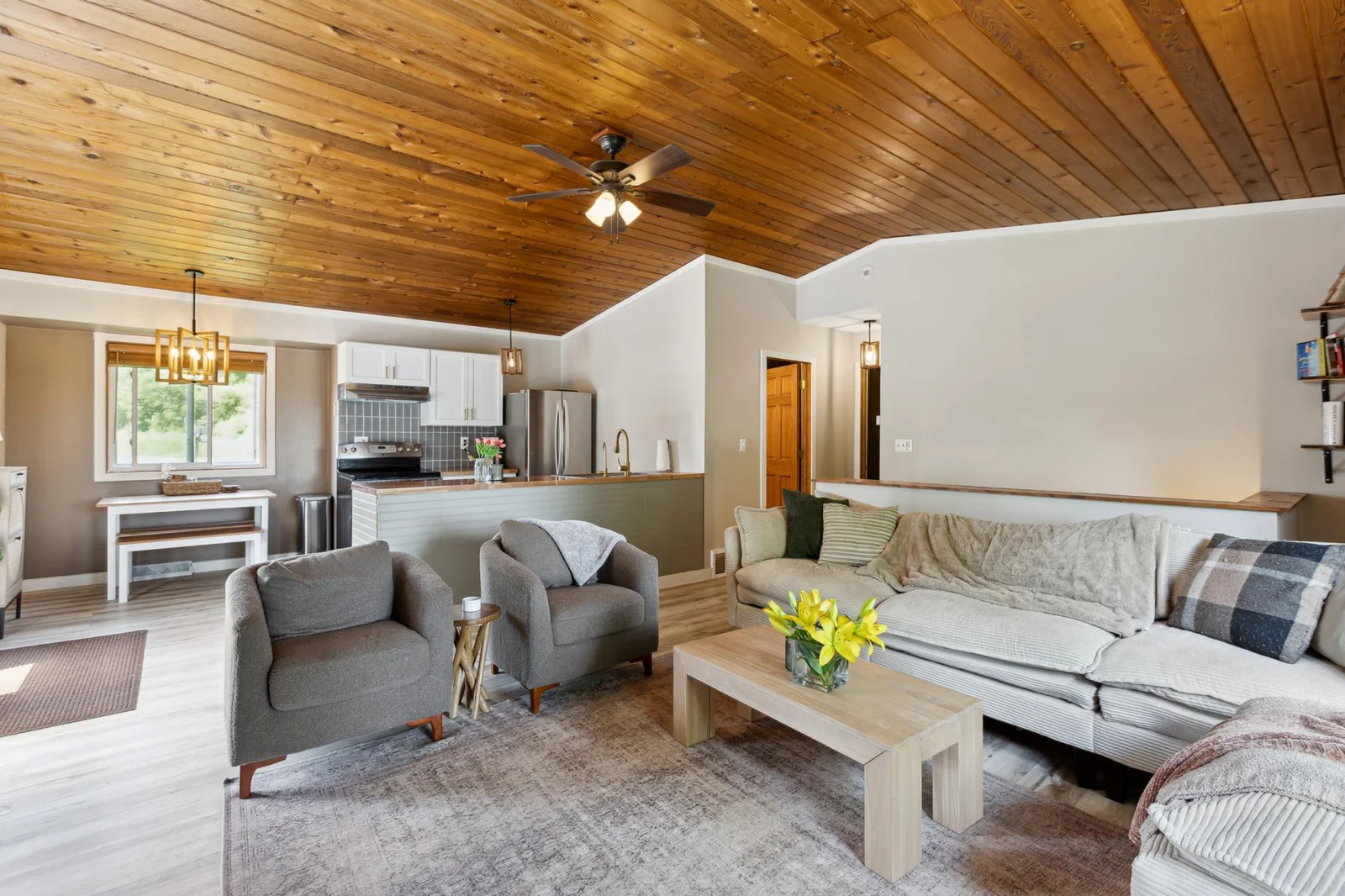 Living room with new lvp flooring, trim, and paint. All furniture can be included in the sale!