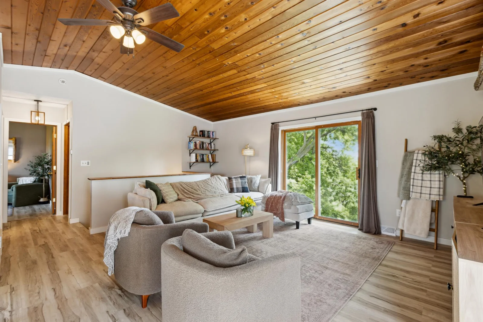 Living room with new lvp flooring, trim, and paint. All furniture can be included in the sale!