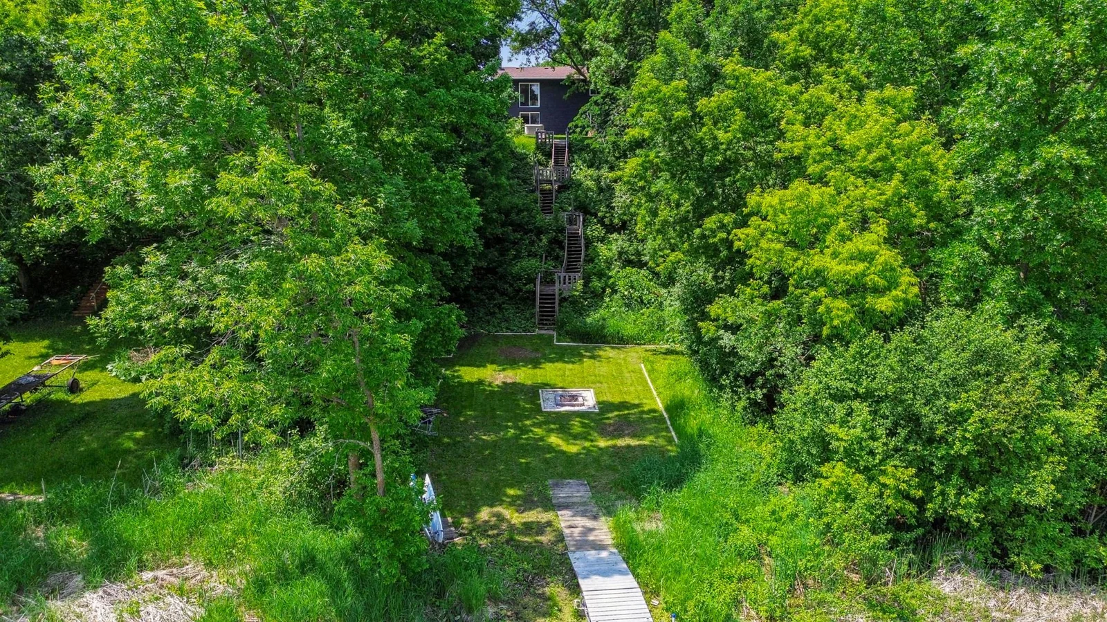 Fire pit area and stairs leading down to the dock