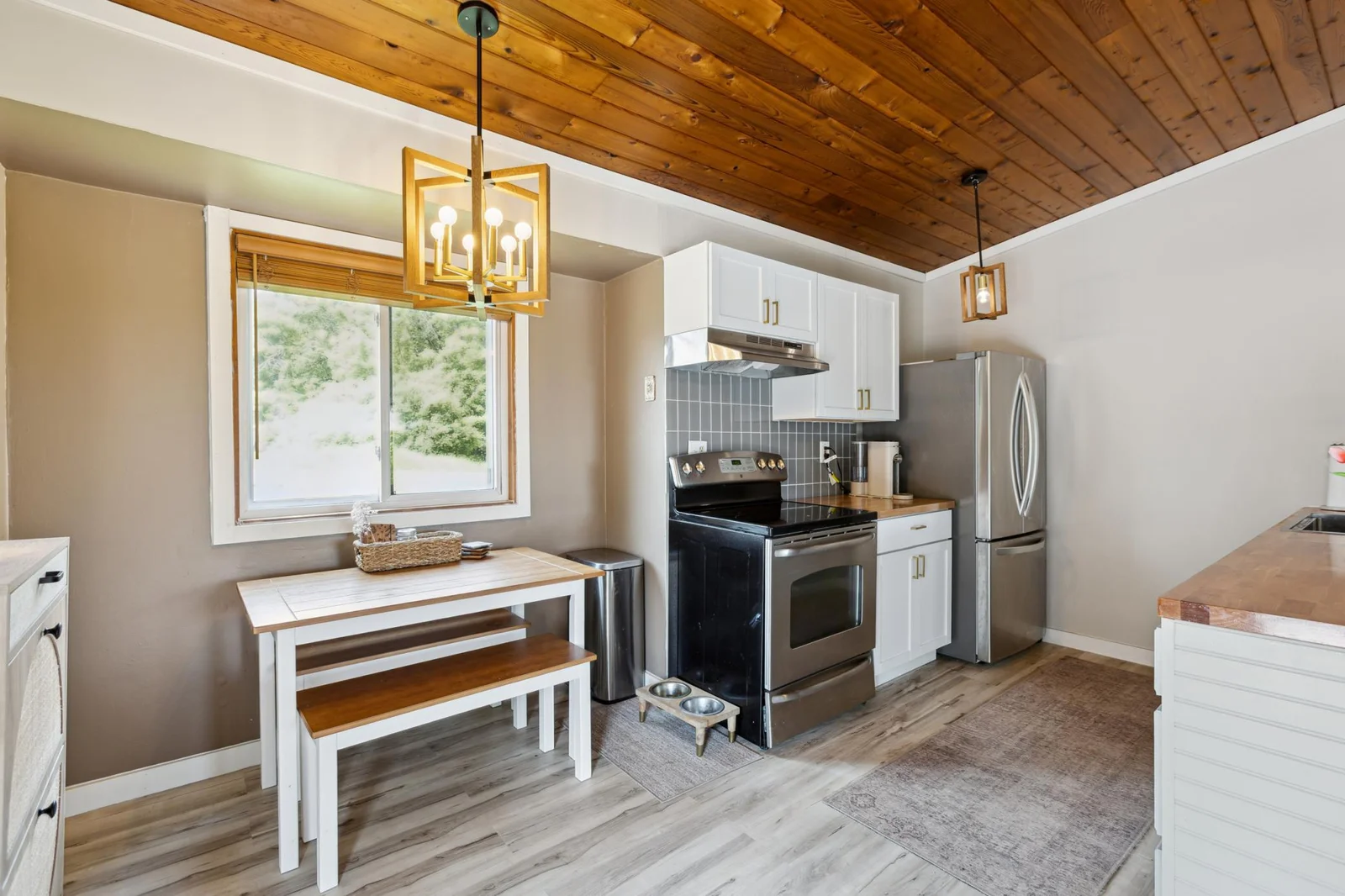 Stainless steel appliances, new fixtures, and subway tile backsplash