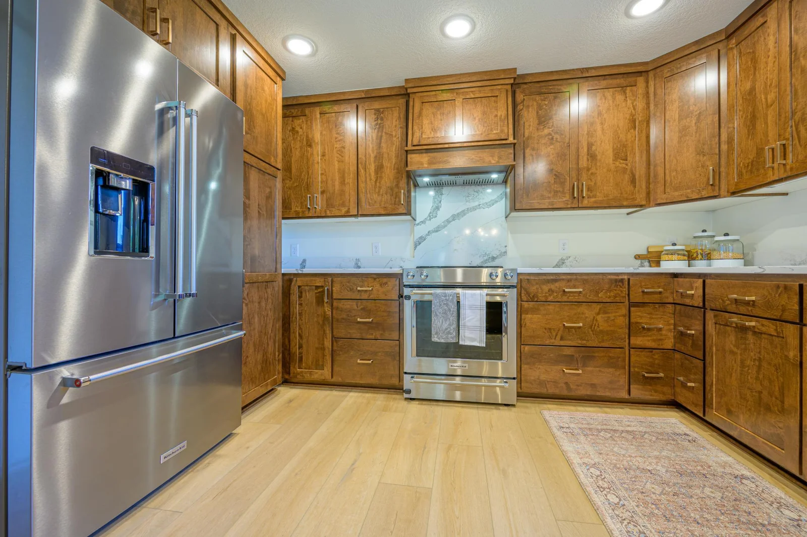 Coretec LVP flooring is featured throughout the main level, including the kitchen.