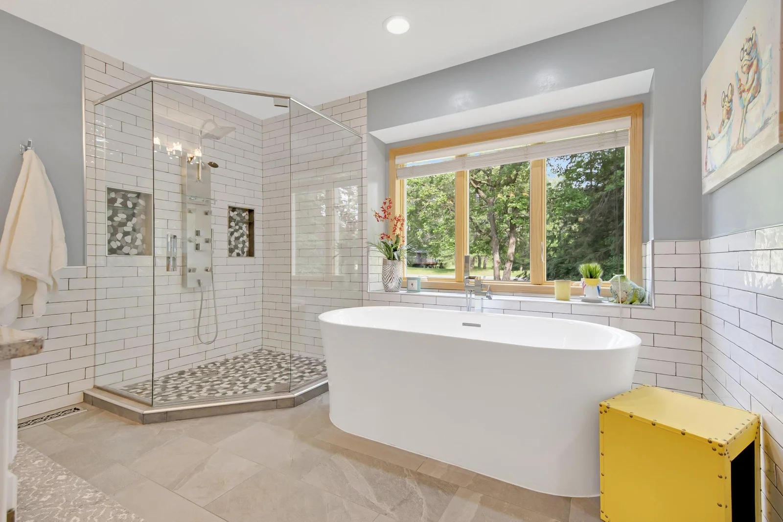 Primary full bathroom with separate tub and shower beautifully finished and maintained.