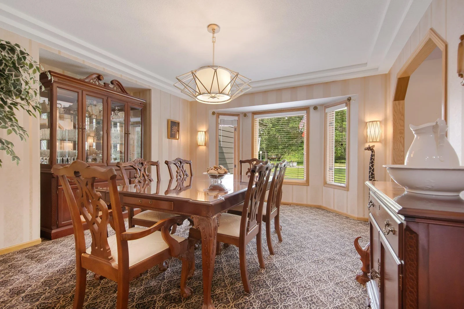 Main level formal dining room with tray ceilings.