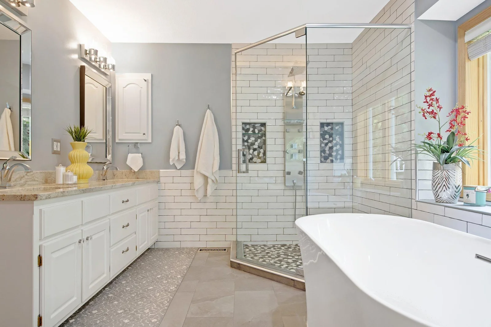 Fully tiled and complete with double sinks, walk in shower, and soaker tub.