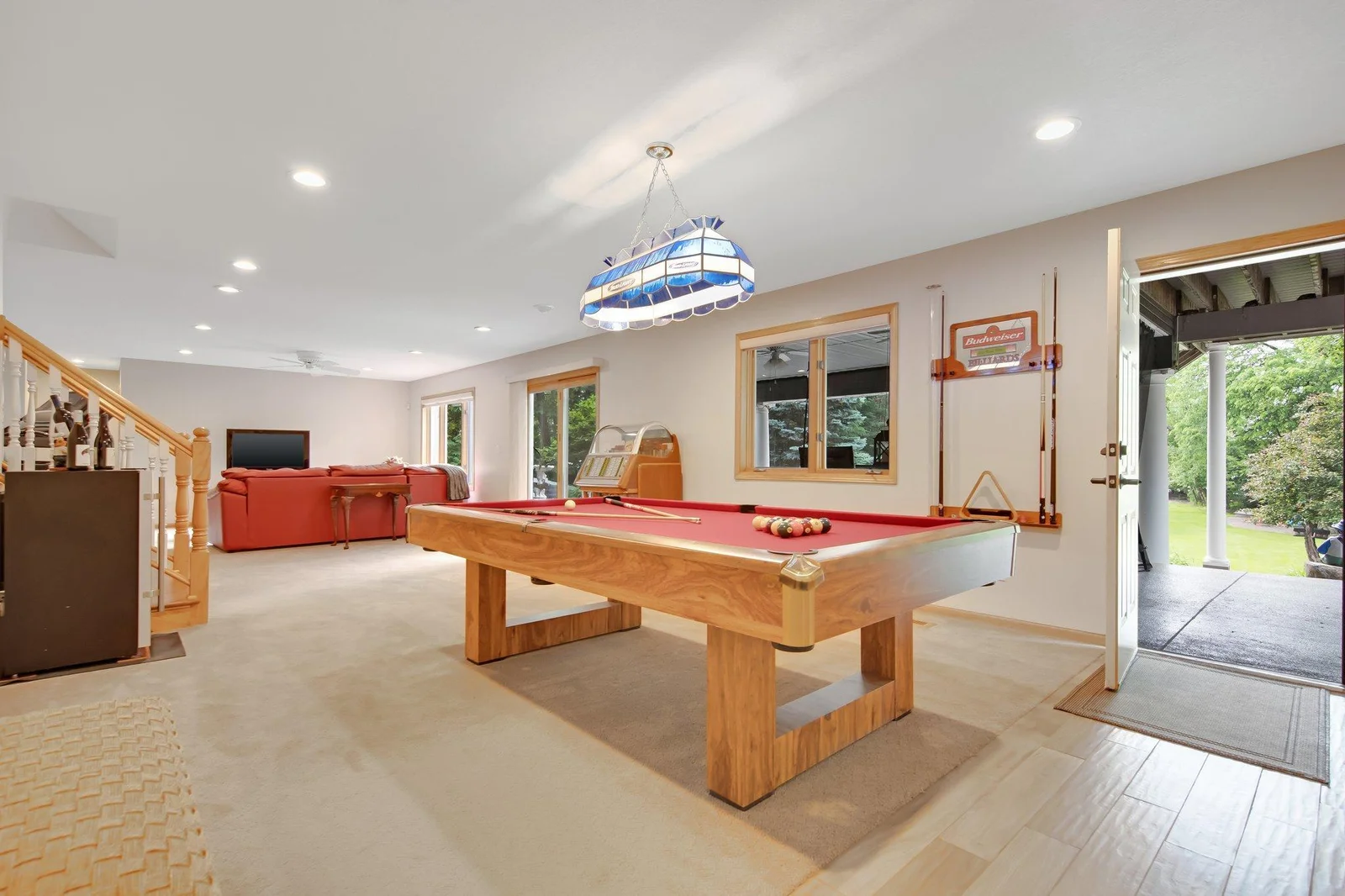This large game room is ready for you to entertain!  Another door leading to the backyard too!