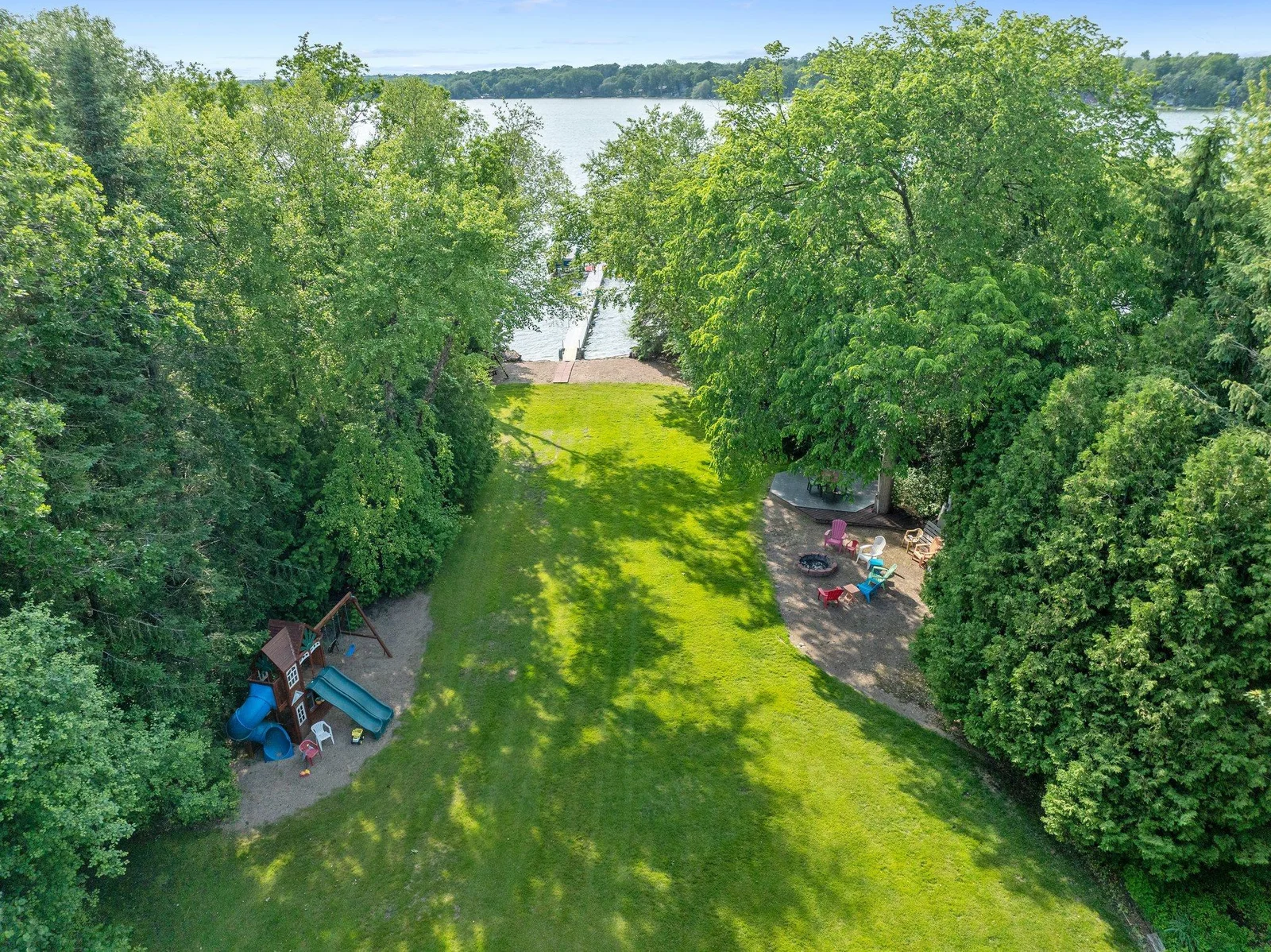 Come in after a day on the lake to enjoy the built-in firepit, playset, patio, and more.