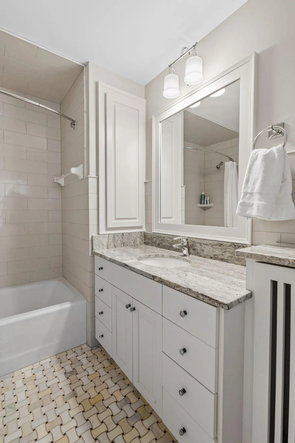 Three full bathrooms are located on the upper levels.
