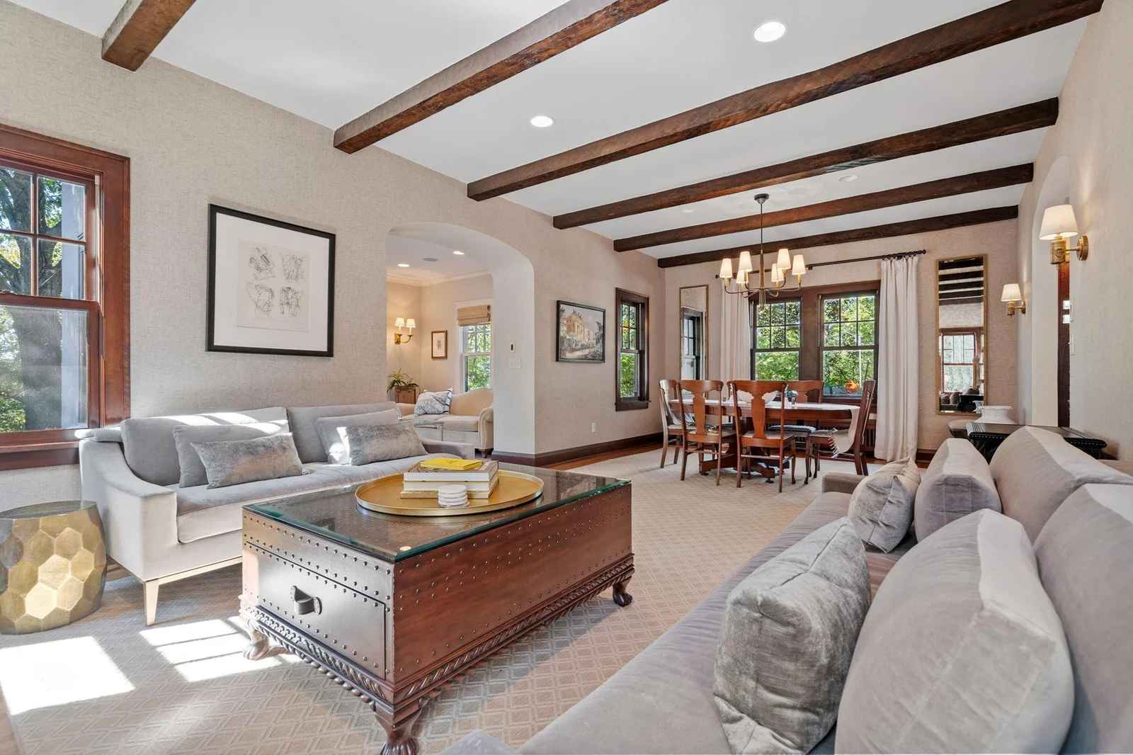 The elegant wood beams and beautiful finish carpentry is cohesive throughout the home.