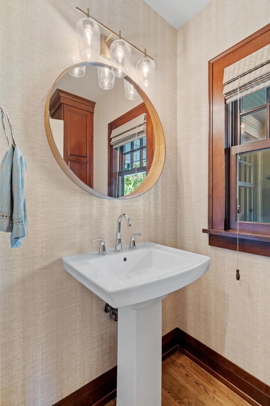 Main floor powder bathroom located near the pool access.