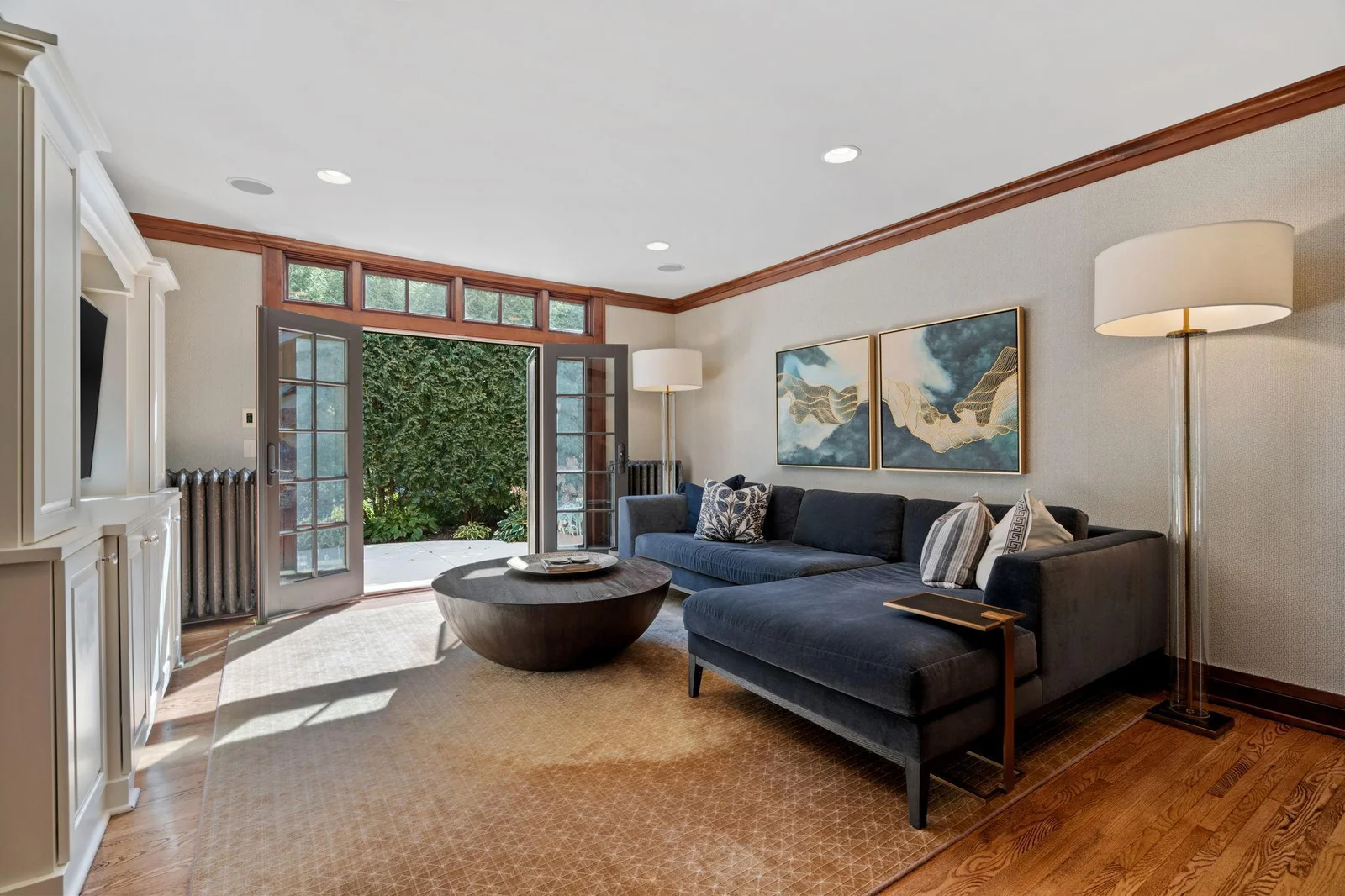One out of three living rooms on the main floor with stunning french doors that lead out to the side porch.