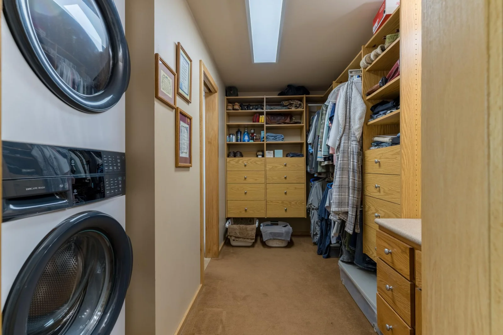 Primary Walk-In Closet with Laundry.jpg