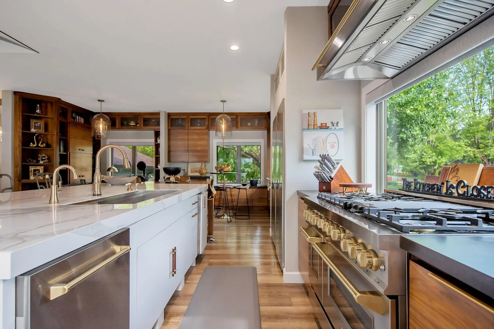 ZLINE appliances (double oven/gas stove/7 burners), 55" SS Sinkology kitchen sink, 33" frig SS  & 33"  freezer, pantry w/ pull out drawers, reverse osmosis to icemaker/wet bar/drinking water,10' center island & custom made Walnut breakfast table.