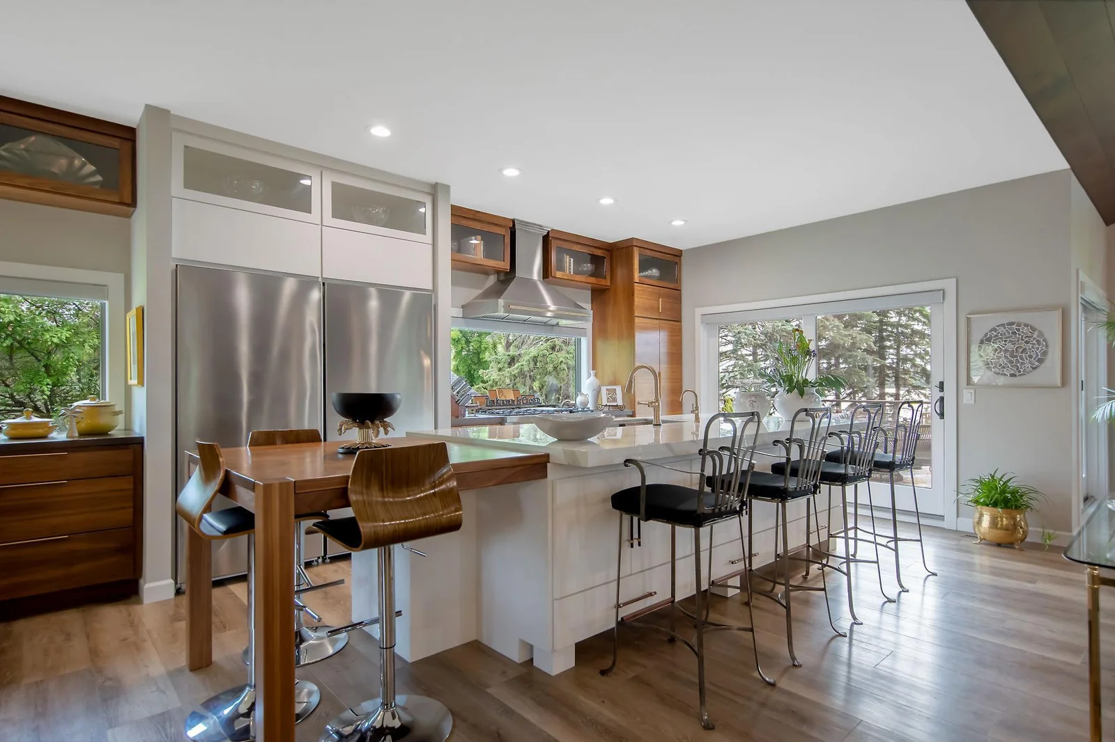 Gourmet kitchen with 10 foot center island and custom built walnut breakfast table.