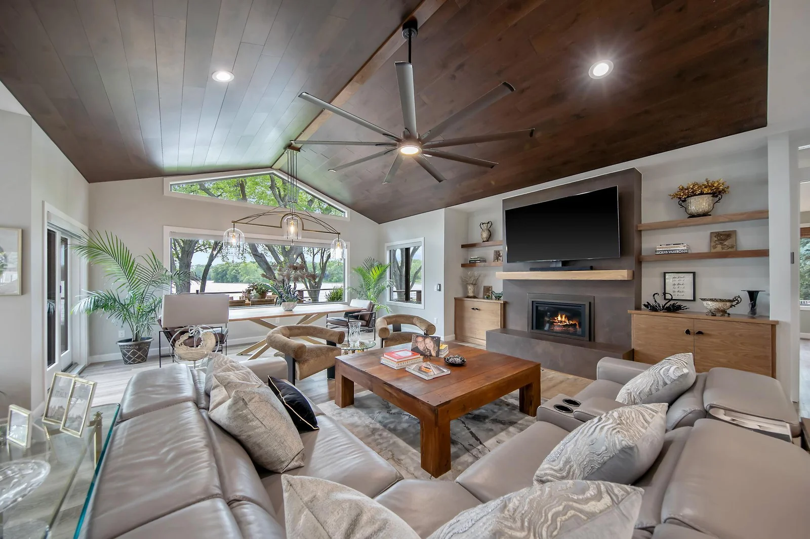 Vaulted walnut ceilings, and a floor to ceiling porcelain surround fireplace are the focal points of the Great Room.