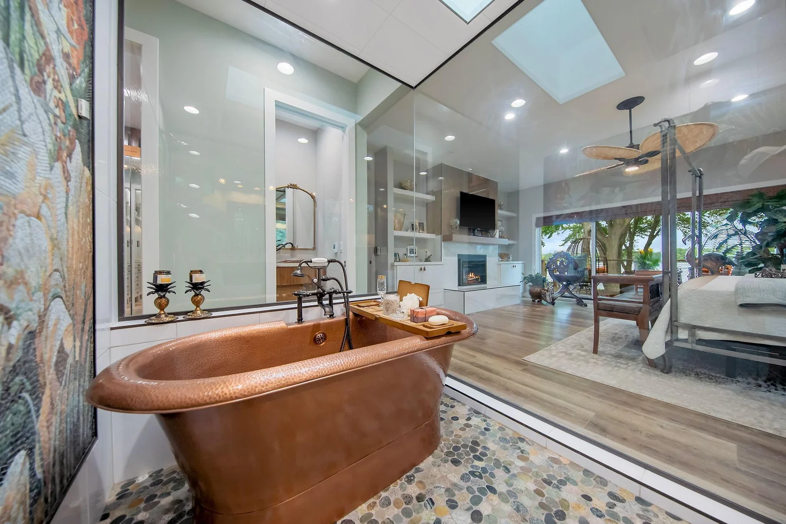 Overlook the lake in the 52 square foot owner's bath spa/ steam room. Copper soaking tub, gorgeous mosaic  wall, rainfall showerhead, natural stone floors and a skylight complete this space.