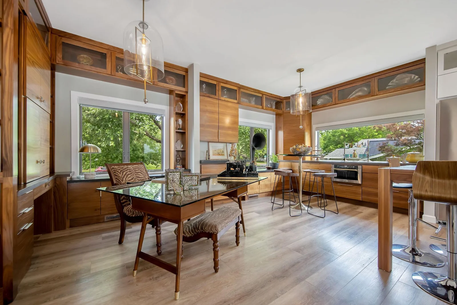 Office is surrounded w/ custom walnut cabinetry offering built in desk w/ doors that glide open for  computer/printer. If wanted, space is left to install glass around the office to maintain the 360 degree views while at work. See renderings at home.