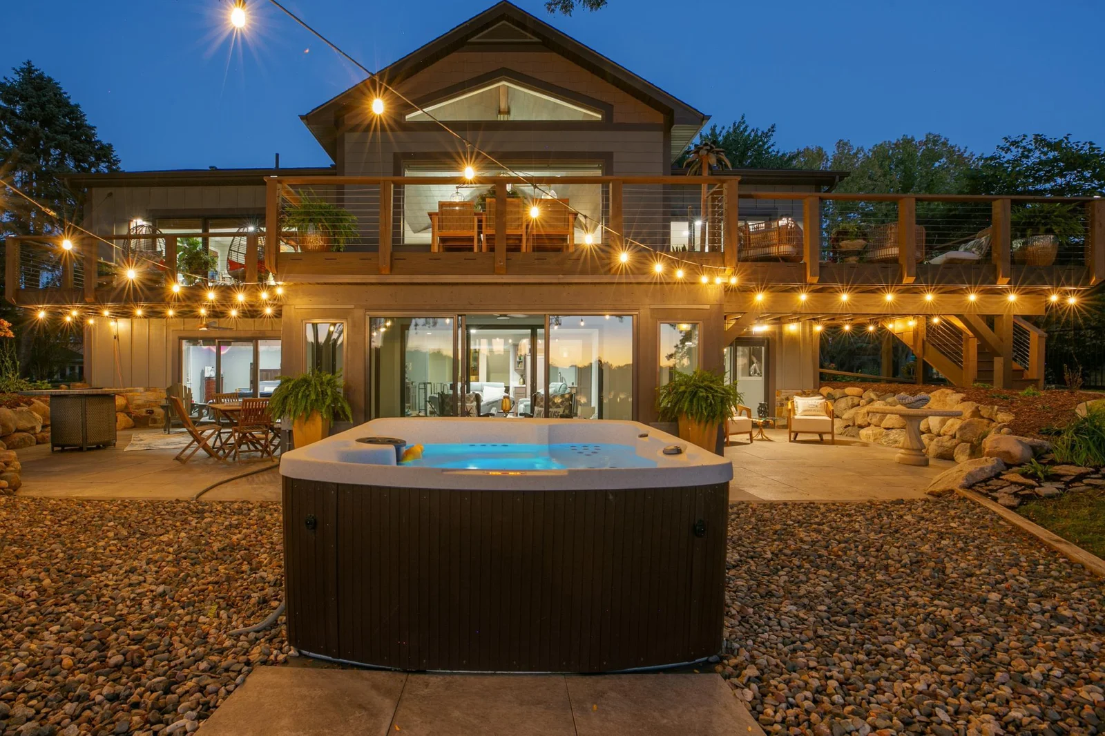 The ideal house for entertaining & family separate space! 6 oversized walkouts lead to 1,700 sq feet of deck/ patios.  Two LL Br's lead to private boulder wall encircled covered patios complete w/ ceiling fans. Deck spans the entire back of the home.