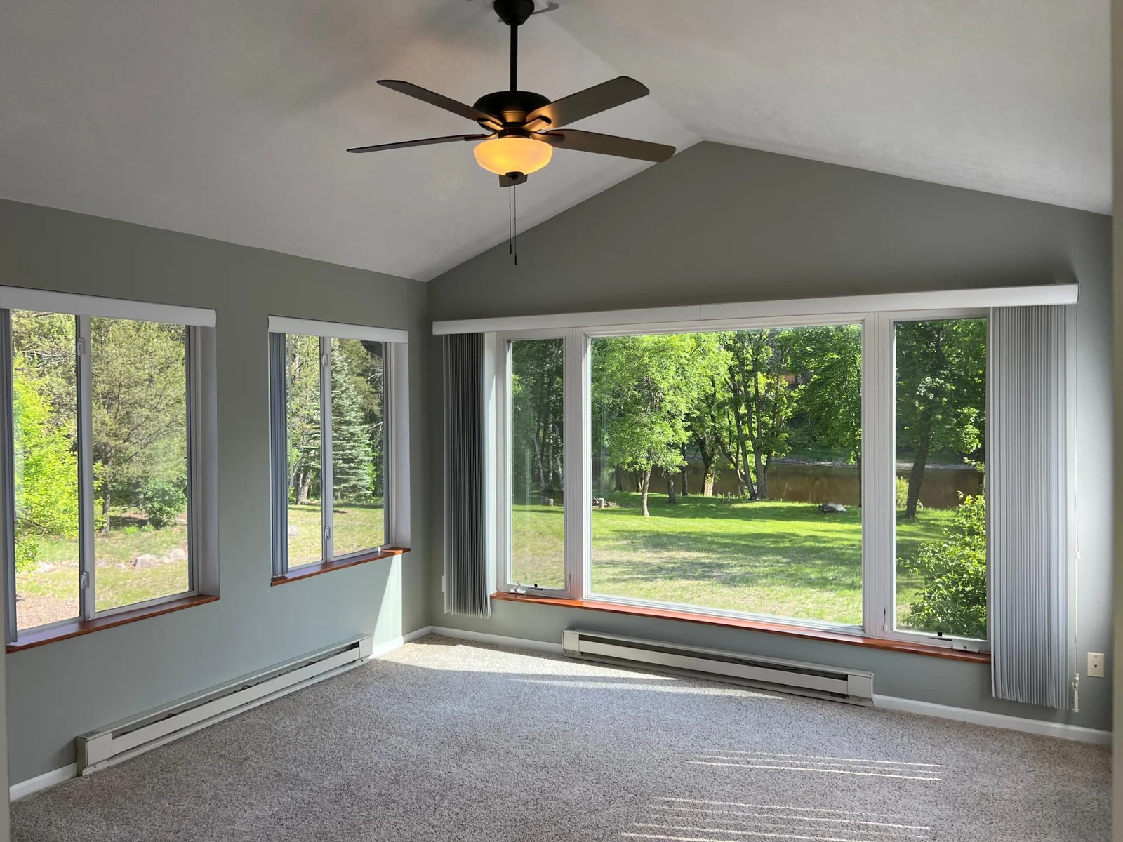 THE SUNROOM !  THIS IS A SPACE YOU'LL ENJOY YEAR ROUND, WITH PANORAMIC VIEWS TO THE RIVER AND A NEVER ENDING PARADE OF WILDLIFE.