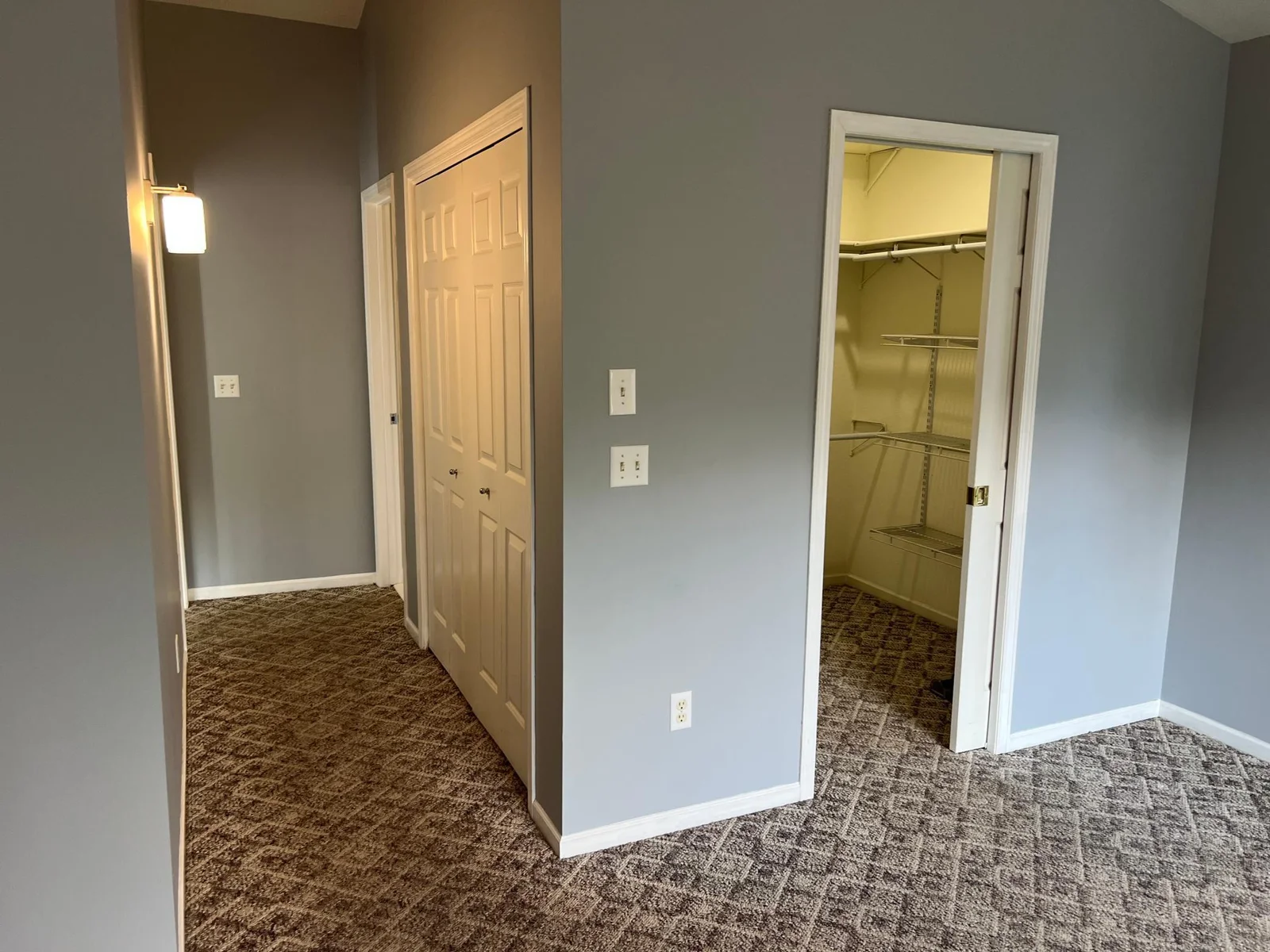 LOOKING BACK DOWN THE HALL; THE BATH IS AT THE END OF THE HALL ON THE RIGHT, THE LIVING ROOM ON THE LEFT.  THE WALK-IN CLOSET IS ON THE RIGHT, WITH A POCKET DOOR.