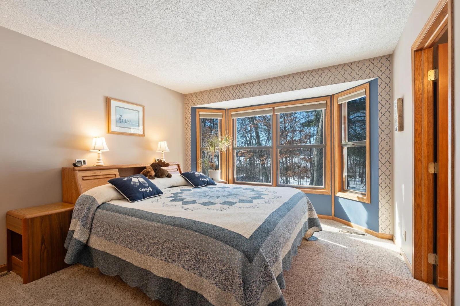 Primary bedroom with large windows
