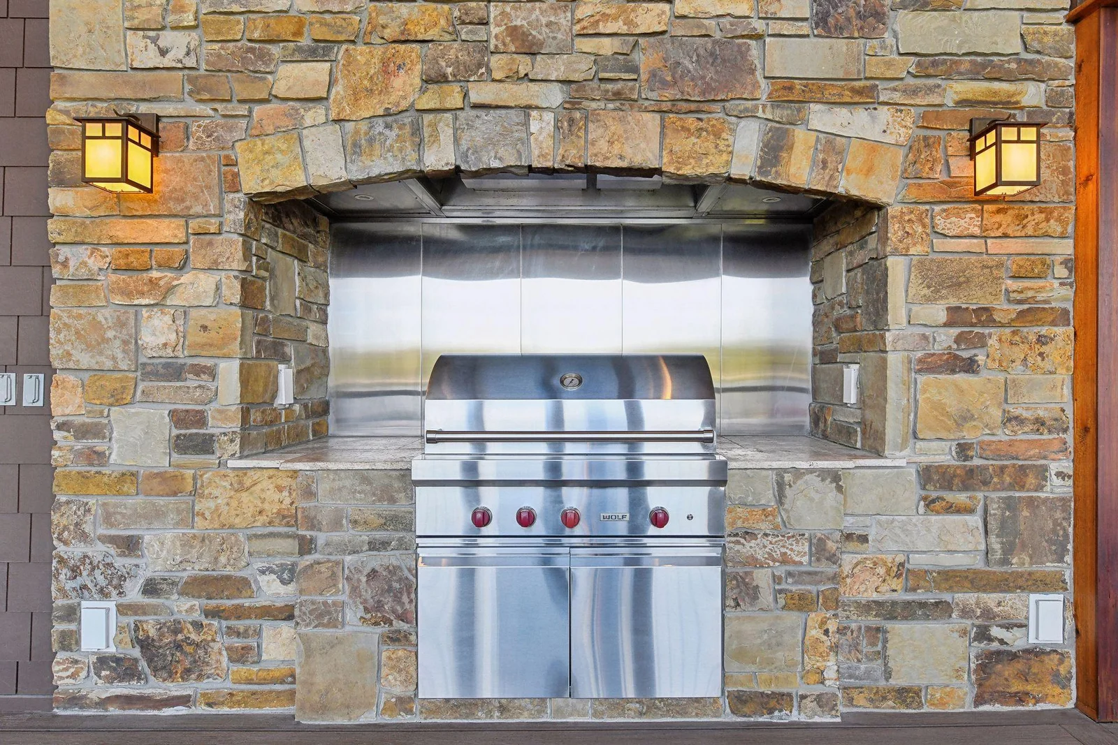 The screen porch also offers a built-in Wolf gas grill and hood - plumbed with a gas line.