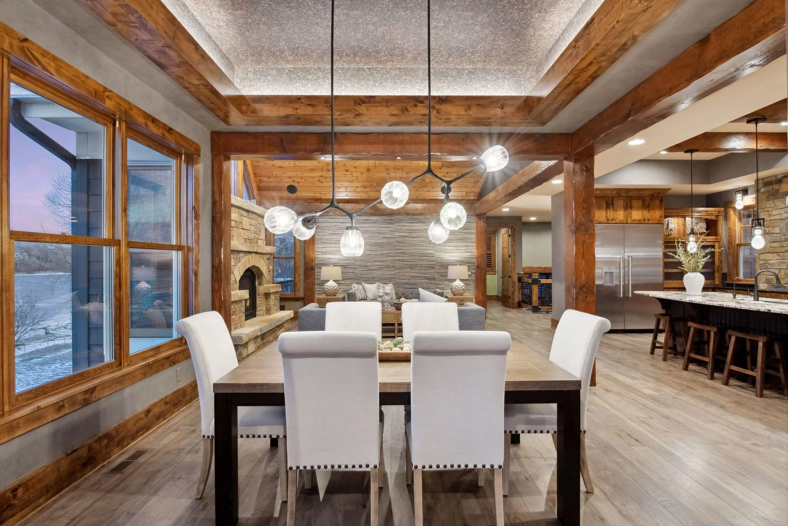 The dining room offers a tray vault ceiling with accent lighting and long lake views.