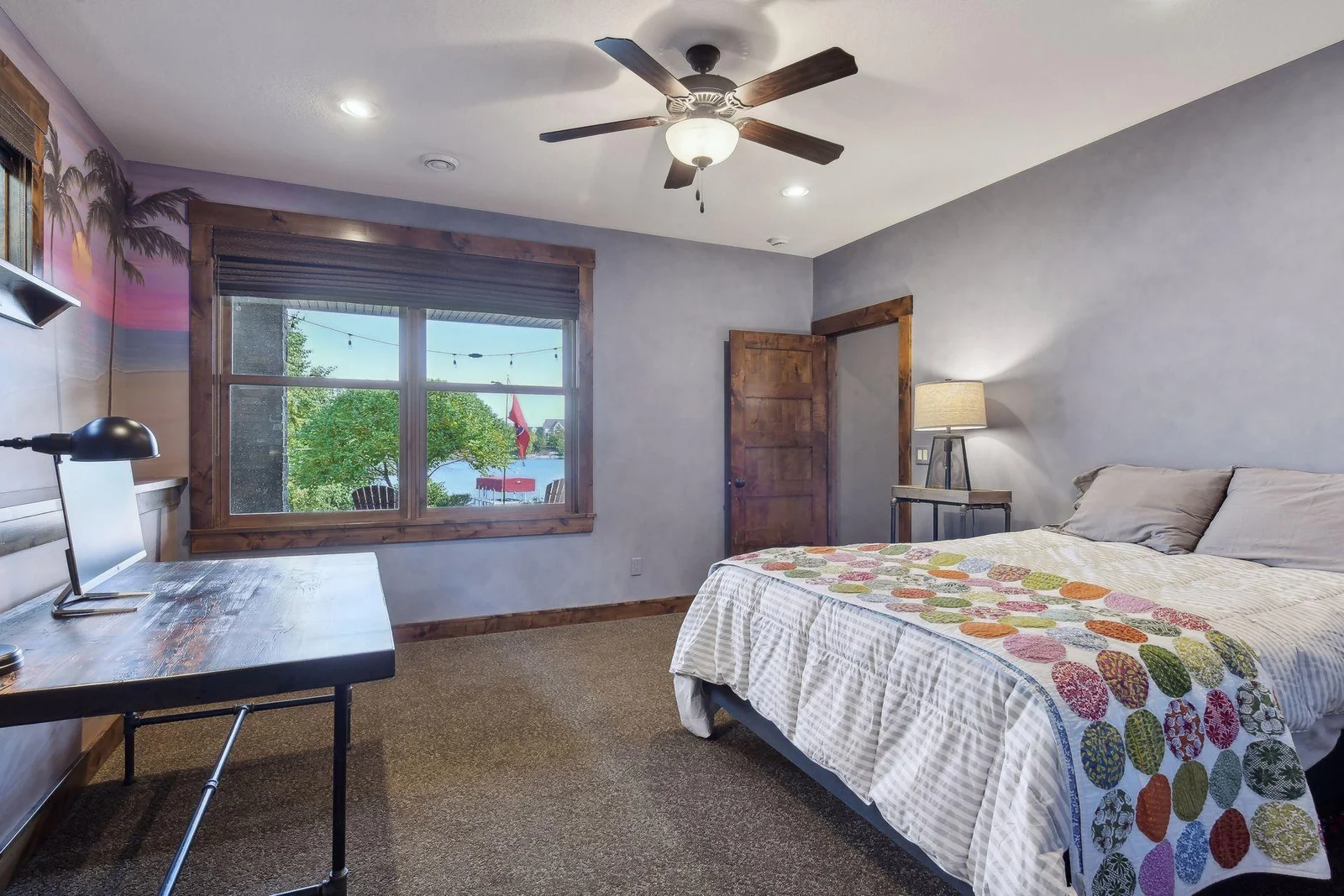 There are two spacious guest bedrooms in the lower level both with lake views - this one offers a spacious walk-in closet.