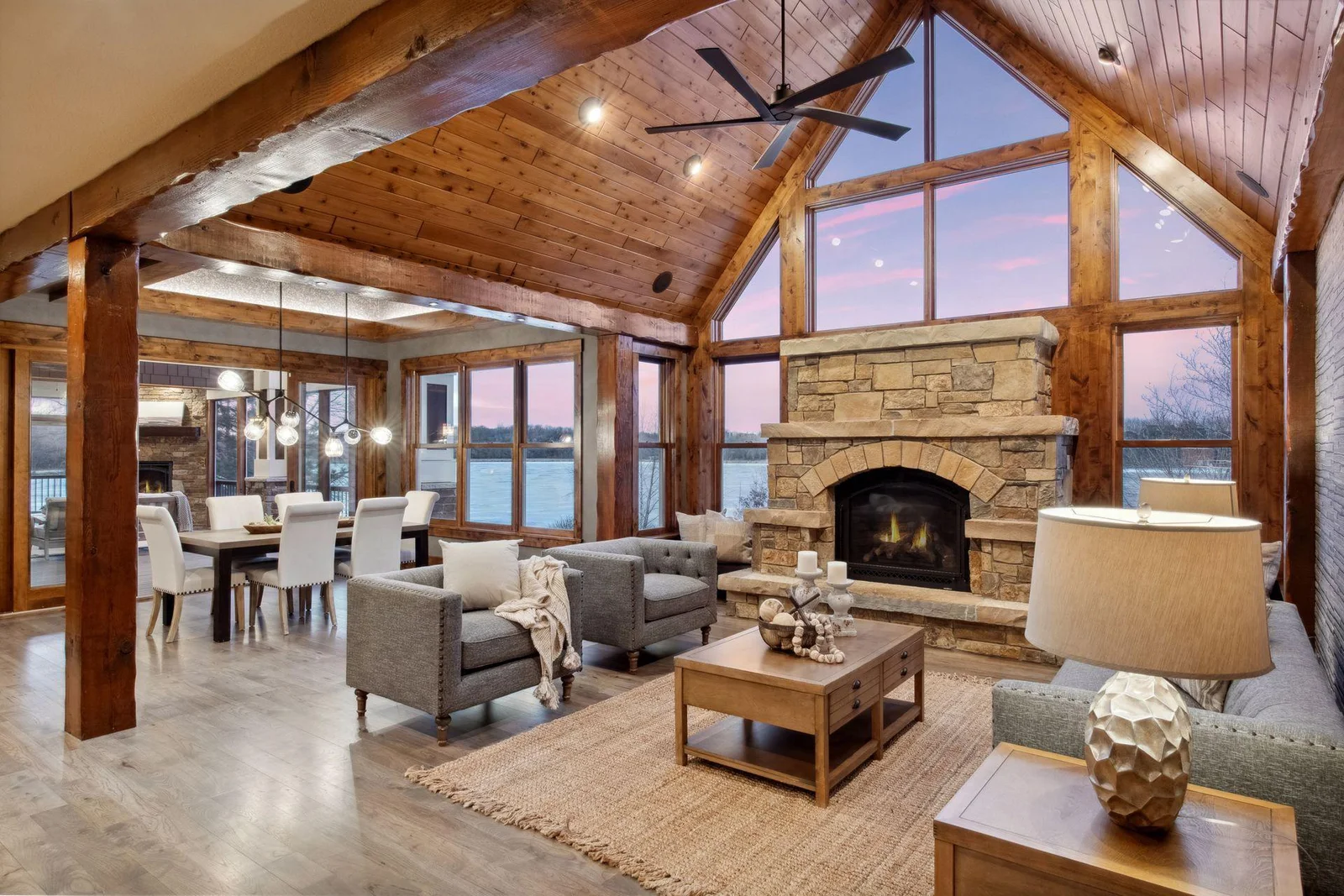 A dramatic vaulted, wood beam ceiling highlights the family room