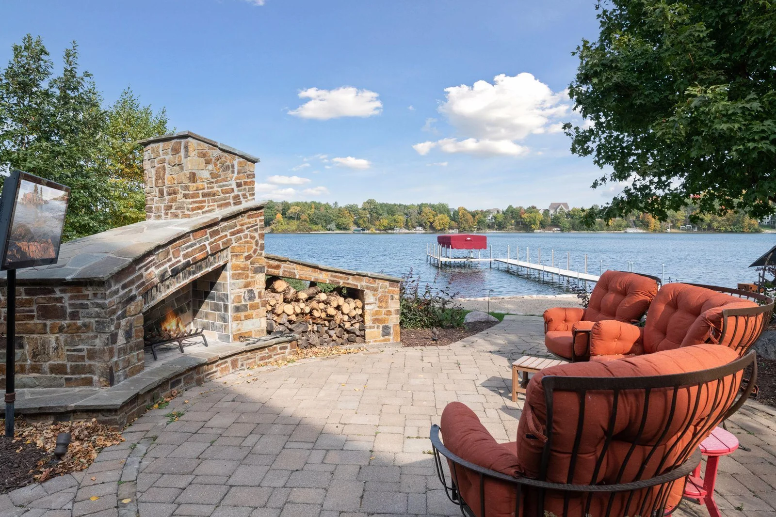 Masterfully crafted, the outdoor fireplace is the perfect place to enjoy lakeside evenings