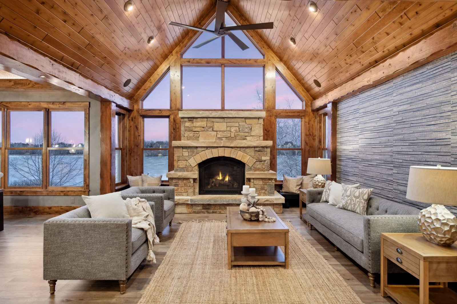 Masterfully crafted with hand hewn timbers and gas fireplace with stone hearth and surround. Built-in window benches offer additional seating.