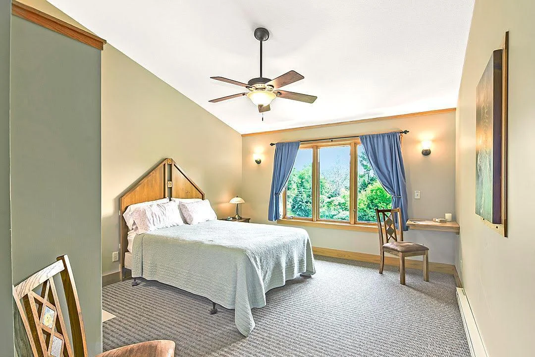 7458 39th Ave NW, Garfield, MN  Main floor bedroom 2 with private 3/4 bath, vaulted ceilings and big windows