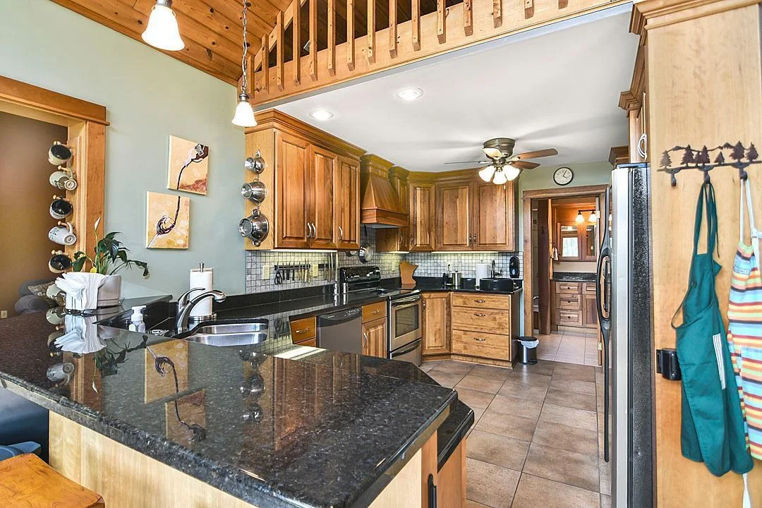 7458 39th Ave, Garfield, MN  The main kitchen is well thought out and offers an open concept, stainless steel appliances, granite countertops, and windows that bring the outside in.