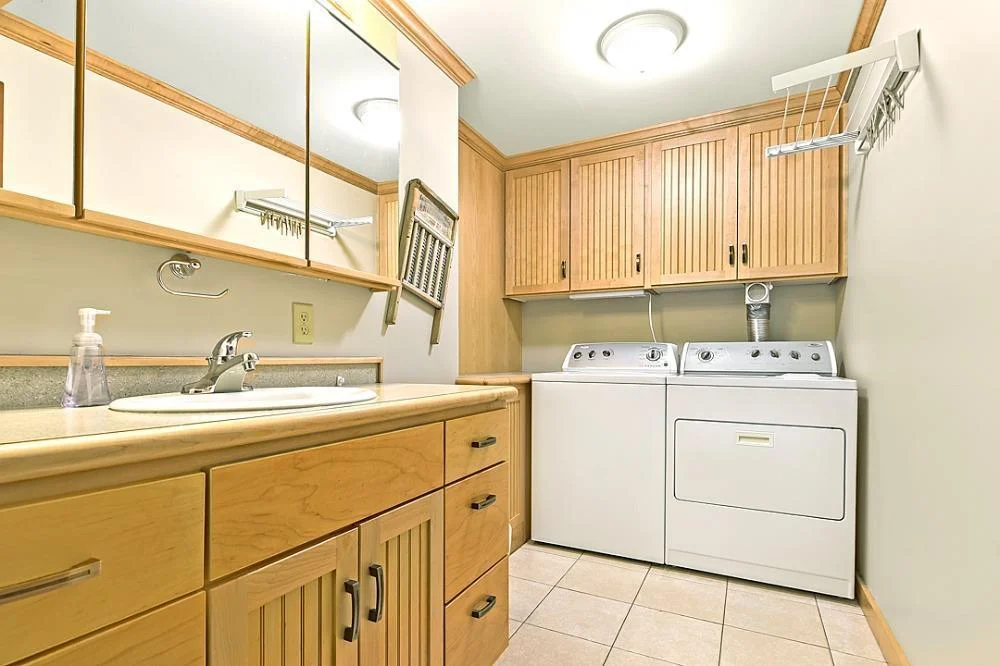 7458 39th Ave NE, Garfield, MN  Second laundry area and bath, beautiful custom cabinets.