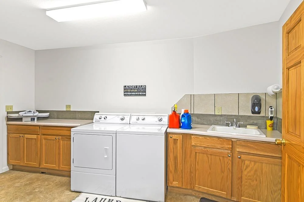 7458 39th Ave NE, Garfield, MN  2nd of 2 laundry rooms with the utility sink and lots of room for storage.