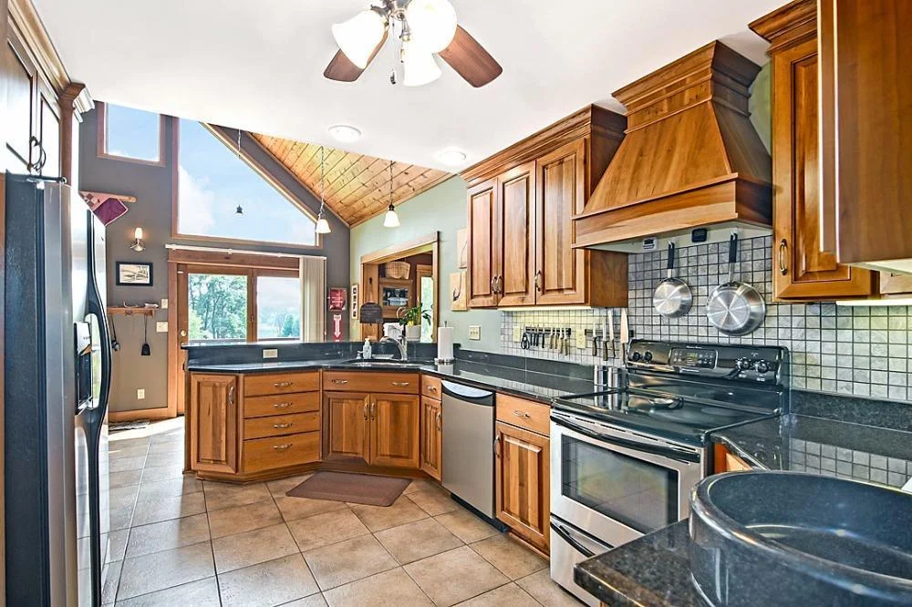 7458 39th Ave NE, Garfield, MN  The main kitchen is well thought out and offers an open concept, stainless steel appliances, granite countertops, and windows that bring the outside in.