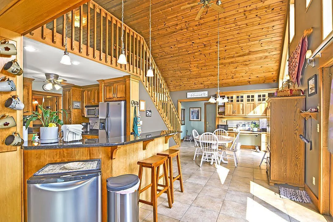 7458 39th Ave NW, Garfield, MN  Bright and sunny kitchen with granite counter tops, stainless steel appliances, and windows that bring natural light to every room.