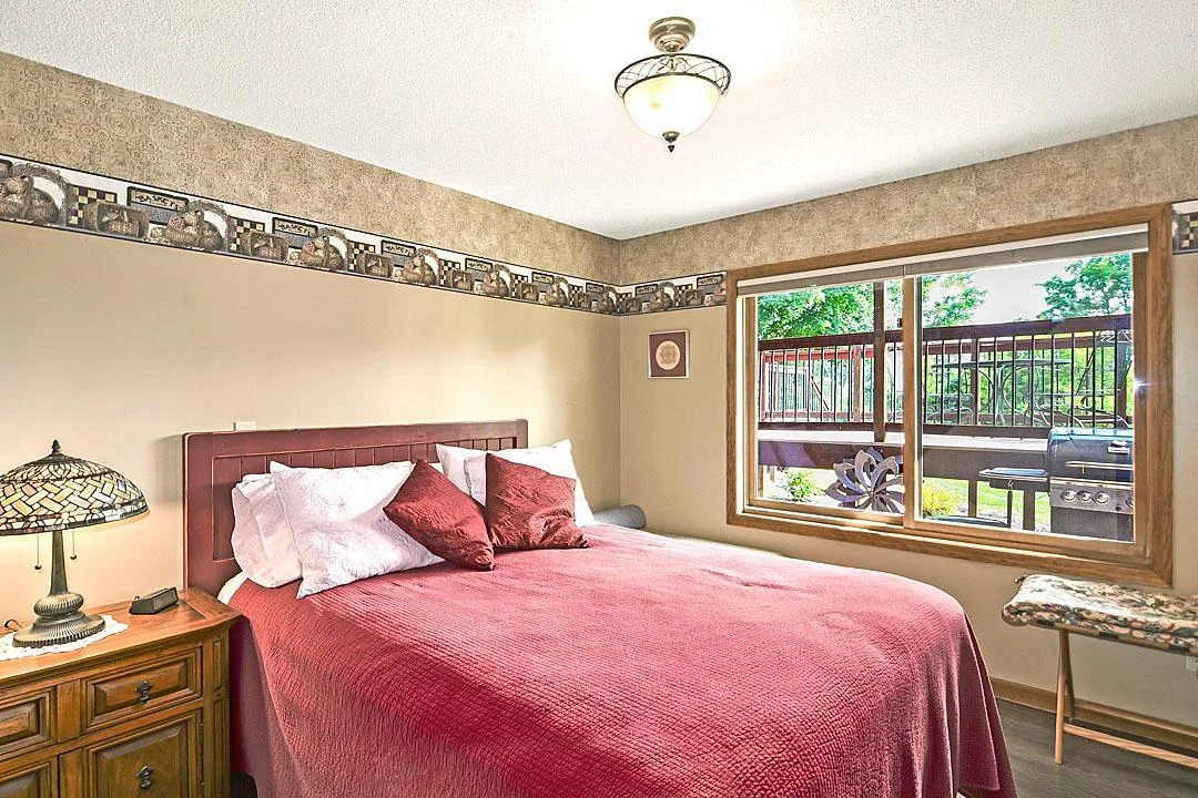 7458 39th Ave, Garfield, MN  Patio level bedroom # 5 is spacious with oversized windows.