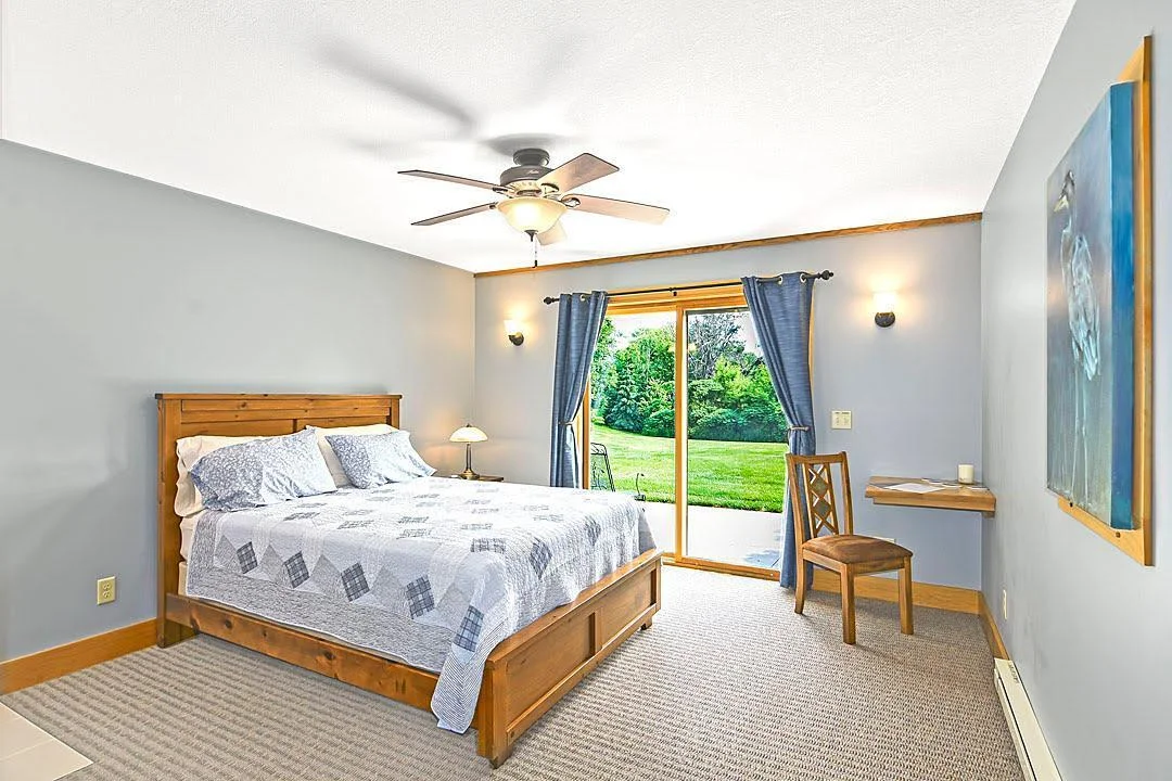 7458 39th Ave NW, Garfield, MN  Patio level offers Bedroom # 6 with a walk out and private 3/4 bath
