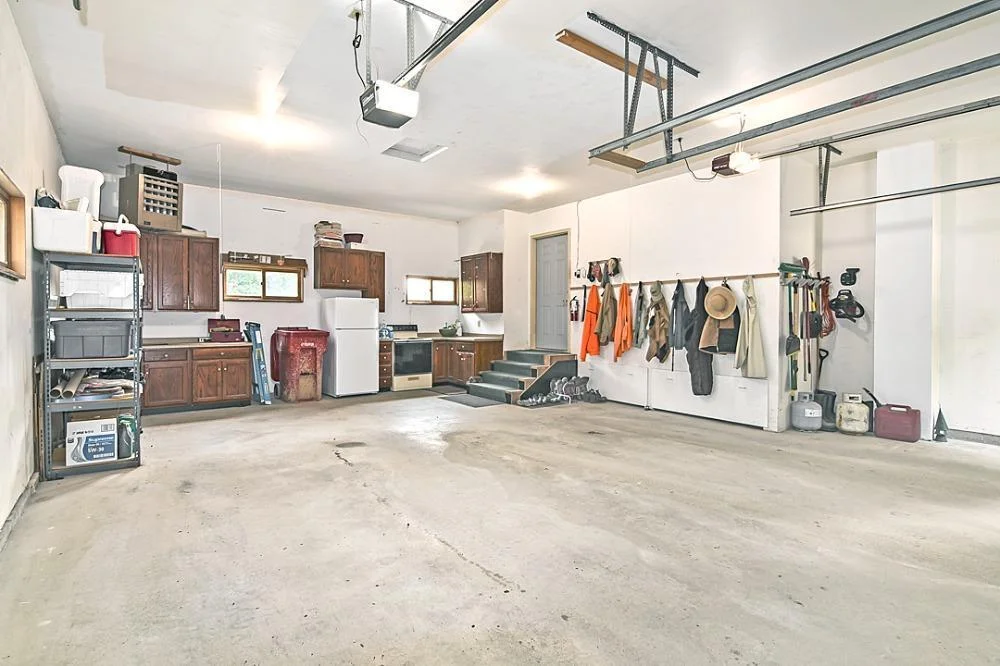 7458 39th Ave NE, Garfield, MN  The oversized garage is finished and heated, all set up with a canning kitchen as well!