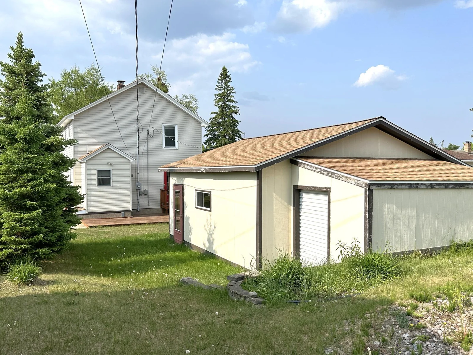 638 E James Back of house with garage and storage shed - Copy.JPG