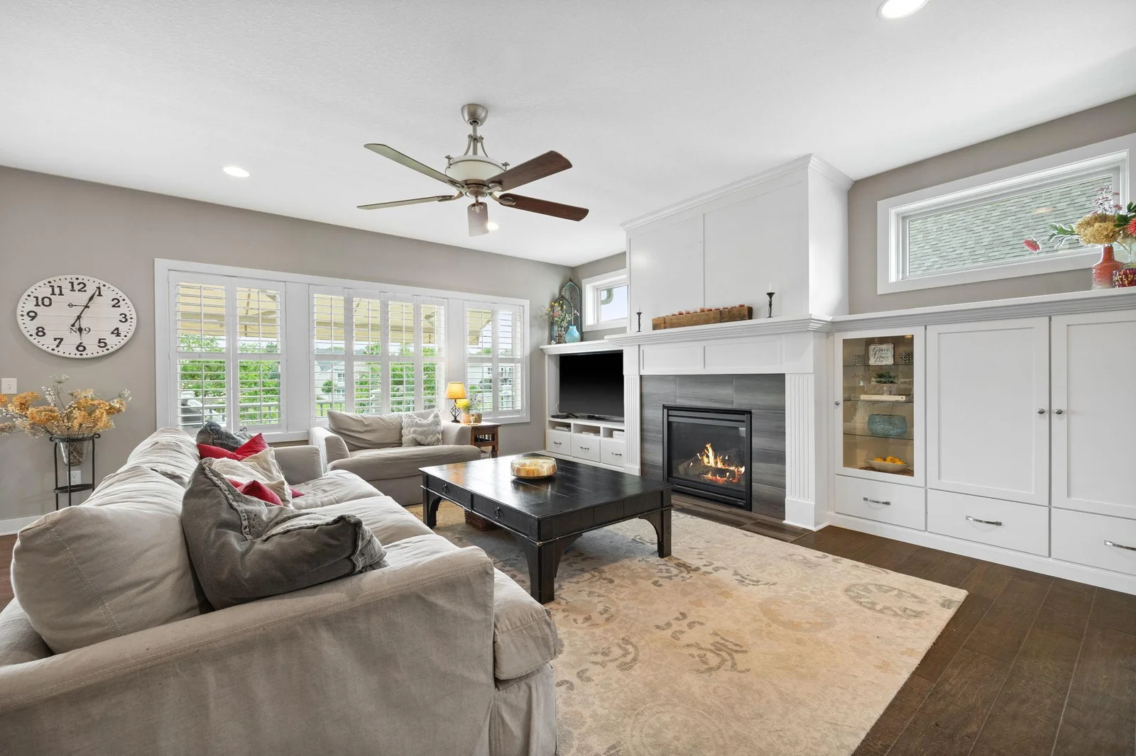 The bright and welcoming living/great room is a show stopper with loads of natural light flooding in